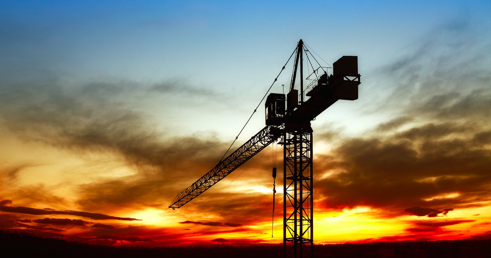 construction crane at sunset